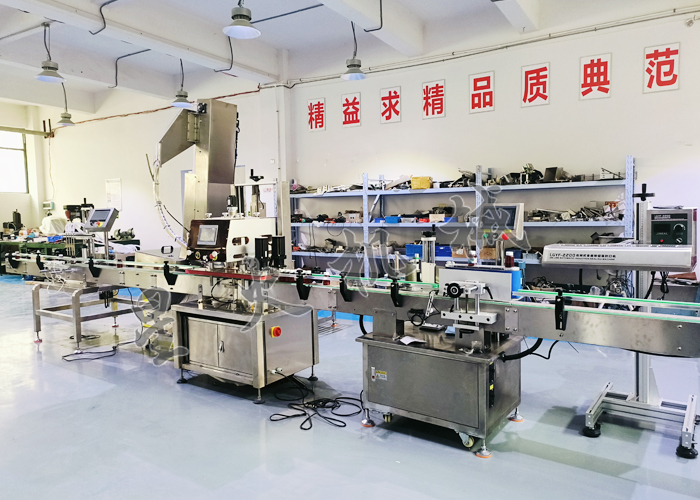 星火液体灌装生产线-旋盖贴标部分